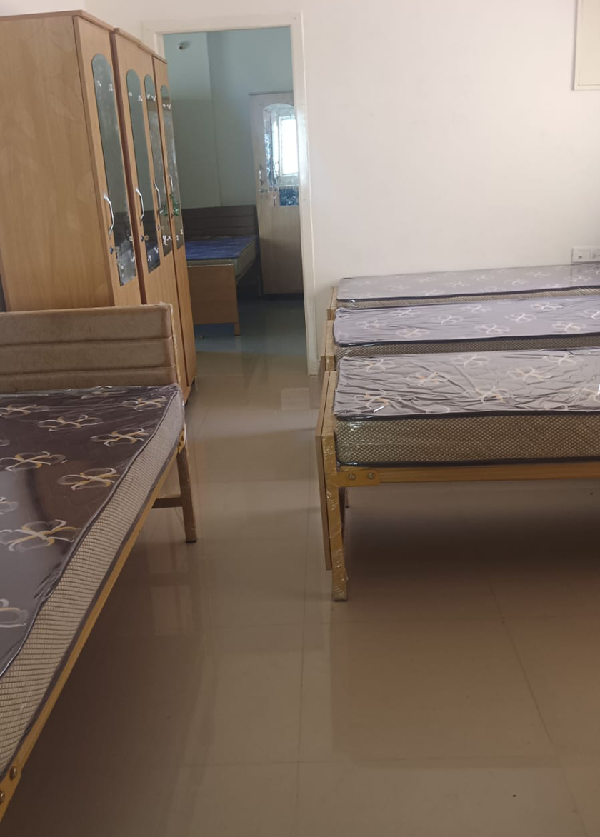 Spacious shared room at Holdings India Ladies Hostel Padur