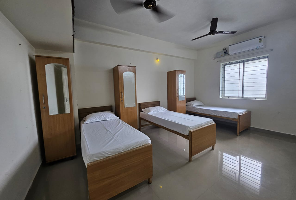 3 sharing room for working women at Holdings India Ladies Hostel